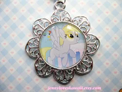 Size: 500x375 | Tagged: safe, derpibooru import, derpy hooves, pegasus, pony, female, jewelry, mare