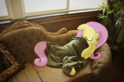 Size: 1000x667 | Tagged: safe, derpibooru import, fluttershy, pegasus, pony, blanket, couch, cute, eyes closed, irl, photo, ponies in real life, shyabetes, sleeping, smiling, solo