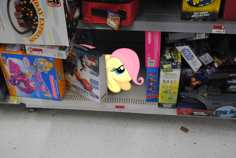 Size: 1600x1071 | Tagged: safe, artist:brosteve, derpibooru import, fluttershy, pony, cute, filly, floppy ears, frown, hair over one eye, hiding, irl, looking up, lost, photo, ponies in real life, prone, sad, scared, shelf, shyabetes, solo, stray, vector, walmart, woobie