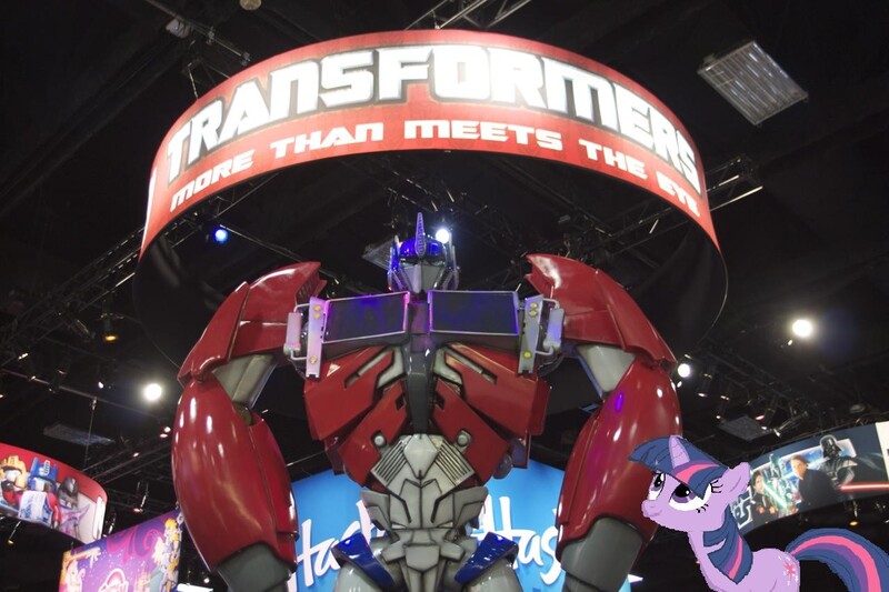 Size: 1280x853 | Tagged: safe, derpibooru import, twilight sparkle, pony, hasbro booth, irl, optimus prime, photo, ponies in real life, san diego comic con, transformers, vector