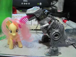 Size: 803x602 | Tagged: artist:zeldatheswordsman, brushable, brushie, brushie brushie, derpibooru import, fluttershy, grimlock, irl, photo, safe, toy, transformers