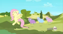 Size: 1366x738 | Tagged: safe, derpibooru import, screencap, fluttershy, pony, sheep, the crystal empire, bipedal, cute, eyes closed, happy, open mouth, skipping, smiling, spread wings, tiny ewes