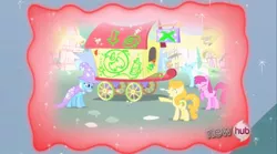 Size: 1178x653 | Tagged: safe, derpibooru import, screencap, berry punch, berryshine, carrot top, golden harvest, shoeshine, trixie, earth pony, pony, unicorn, magic duel, cape, clothes, cruel, female, graffiti, hat, laughing, mare, mean, quartet, sad, sadness, taunt, taunting, trixie's cape, trixie's hat, trixie's wagon, trixiebuse, vandalism, wagon, woobie