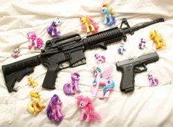 Size: 1986x1451 | Tagged: applejack, ar15, barely pony related, brushable, derpibooru import, glock, gun, irl, photo, pinkie pie, pistol, princess celestia, rainbow dash, rarity, rifle, safe, spike, toy, twilight sparkle, weapon