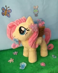 Size: 600x747 | Tagged: safe, artist:sequinjar, derpibooru import, fluttershy, butterfly, parasprite, pony, cute, flower, flower in mouth, irl, mouth hold, photo, plushie