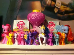 Size: 2592x1936 | Tagged: applejack, balloon, brushable, derpibooru import, dvd, figurine, fim logo, fluttershy, irl, mane six opening poses, my little pony logo, photo, pinkie pie, princess celestia, princess luna, rainbow dash, rarity, safe, spike, toy, twilight sparkle