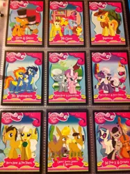 Size: 1936x2592 | Tagged: safe, derpibooru import, braeburn, carrot cake, cranky doodle donkey, cup cake, diamond tiara, doctor whooves, hoity toity, matilda, mayor mare, octavia melody, photo finish, pound cake, pumpkin cake, silver spoon, snails, snips, soarin', spitfire, time turner, vinyl scratch, donkey, earth pony, pony, unicorn, card, crankilda, irl, merchandise, photo, trading card