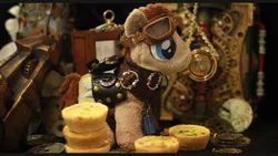 Size: 1280x720 | Tagged: artist:saturnspace, clockwise whooves, derpibooru import, doctor whooves, food, goggles, irl, photo, plushie, quiche, safe, steampunk, time turner