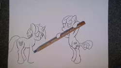 Size: 3552x1998 | Tagged: dead source, safe, artist:mostlyponyart, derpibooru import, bon bon, lyra heartstrings, sweetie drops, earth pony, pony, unicorn, bipedal, blushing, creation, drawing, drawn into existence, duo, pencil, pencil drawing, photo, smiling, traditional art