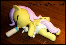 Size: 2260x1560 | Tagged: safe, artist:madponyscientist, derpibooru import, fluttershy, pony, rabbit, baby, baby bottle, baby pony, babyshy, custom, cute, diaper, filly, foal, hnnng, milk, sculpture, shyabetes, younger