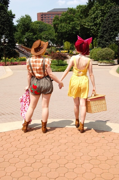 Size: 598x900 | Tagged: apple bloom, applejack, artist:envelcosplay, artist:juju-gurl, basket, cosplay, derpibooru import, holding hands, human, irl, irl human, overalls, photo, safe