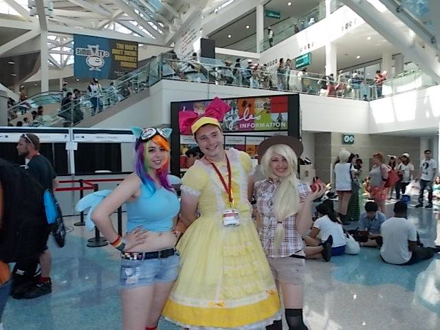 Size: 640x480 | Tagged: anime expo, apple bloom, applejack, artist:agentt3xas, artist:geekeryandsuch, artist needed, belly button, convention, cosplay, derpibooru import, human, irl, irl human, midriff, photo, rainbow dash, safe