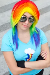 Size: 427x640 | Tagged: safe, artist:magyktrix, derpibooru import, rainbow dash, human, clothes, cosplay, crossed arms, fingerless gloves, gloves, irl, irl human, photo, solo, sunglasses