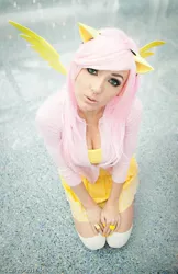 Size: 582x900 | Tagged: cleavage, clothes, cosplay, cute, derpibooru import, female, fluttershy, human, irl, irl human, jessica nigri, photo, safe, solo, sweater, sweatershy