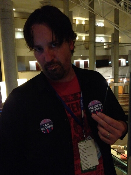 Size: 600x800 | Tagged: safe, derpibooru import, human, button, i believe in m.a. larson, i believe in x, irl, irl human, larson you magnificent bastard, m.a. larson, photo, solo, toothpick