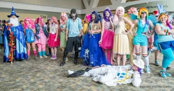 Size: 1280x669 | Tagged: artist:thearcdesigns, artist:xenro8, book, bronycon, clothes, cosplay, derpibooru import, dress, elusive, fluttershy, gala dress, group photo, human, irl, irl human, photo, pinkie pie, rainbow dash, rarity, rule 63, safe, star swirl the bearded, twilight sparkle