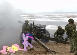 Size: 900x643 | Tagged: artillery, artist:cplhenderson, cadpat, canada, derpibooru import, eyes closed, fluttershy, howitzer, human, irl, irl human, military, open mouth, photo, ponies in real life, prone, safe, scared, twilight sparkle