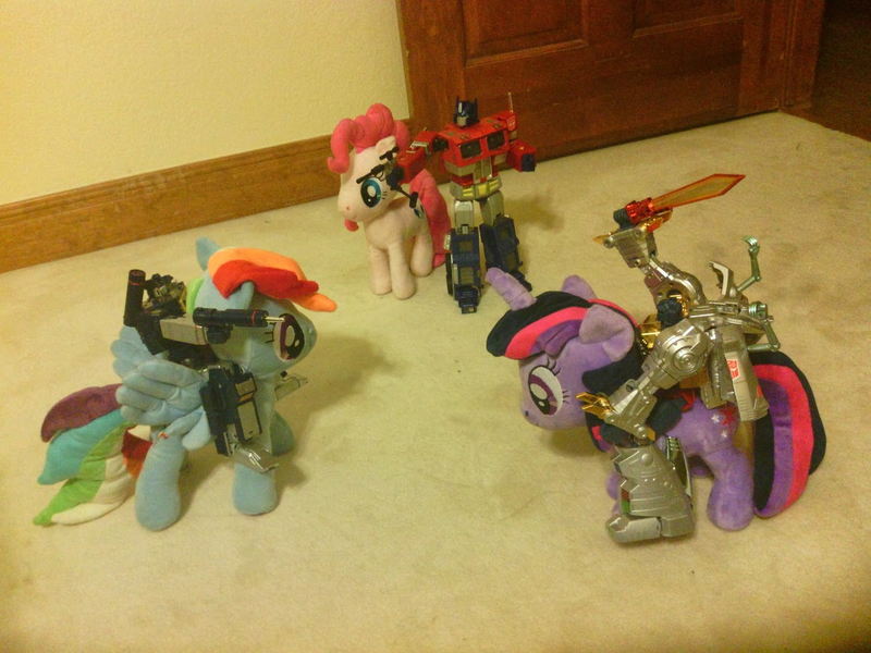 Size: 1313x985 | Tagged: cavalry, derpibooru import, grimlock, irl, megatron, nici, optimus prime, photo, pinkie pie, plushie, rainbow dash, riding, safe, soundwave, toy, toy pony cavalry, transformers, twilight sparkle