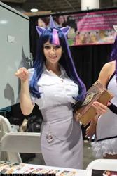 Size: 800x1200 | Tagged: artist:ridd1e, artist:yayacosplay, book, clothes, comikaze expo, convention, cosplay, derpibooru import, human, irl, irl human, photo, safe, skirt, solo, stall, tube skirt, twilight sparkle