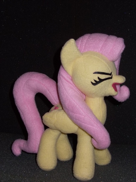 Size: 2736x3648 | Tagged: safe, derpibooru import, fluttershy, pegasus, pony, eyes closed, female, flutteryay, irl, mare, photo, plushie, solo, yay