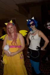 Size: 2581x3872 | Tagged: 2012, artist needed, clothes, cosplay, derpibooru import, dragoncon, fluttershy, gloves, headphones, human, irl, irl human, photo, photobomb, plushie, safe, sunglasses, the joker, vinyl scratch