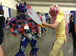 Size: 960x717 | Tagged: bronycon, butterscotch, chainsaw, convention, cosplay, derpibooru import, fluttershed, fluttershy, human, irl, irl human, max gilardi, .mov, murdershy, optimus prime, photo, rule 63, safe, shed.mov, source needed, transformers, weapon