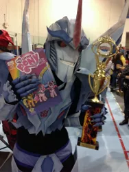 Size: 2448x3264 | Tagged: source needed, safe, derpibooru import, idw, human, brony, comic, convention, cosplay, irl, irl human, merchandise, photo, starscream, transformers, transformers prime, trophy