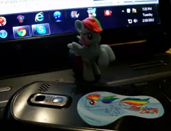 Size: 598x458 | Tagged: blind bag, computer, derpibooru import, irl, laptop computer, phone, photo, rainbow dash, safe, sticker, toy, windows, windows 7