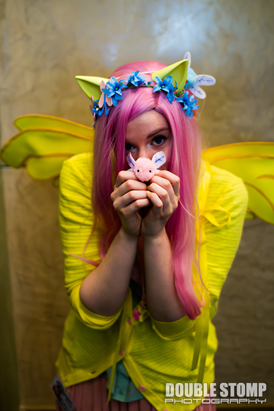 Size: 533x800 | Tagged: artist needed, safe, artist:art gent, derpibooru import, fluttershy, human, parasprite, 2013, convention, cosplay, floral head wreath, irl, irl human, nashicon, nashicon 2013, photo, solo