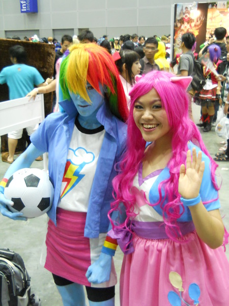 Size: 1280x1707 | Tagged: artist needed, safe, artist:leekeybeth, derpibooru import, pinkie pie, rainbow dash, human, equestria girls, bodypaint, comic fiesta, cosplay, football, irl, irl human, photo