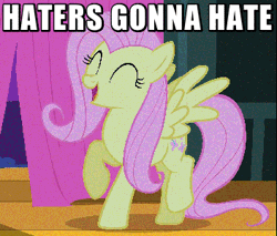 Size: 352x300 | Tagged: safe, derpibooru import, screencap, fluttershy, pegasus, pony, filli vanilli, animated, caption, cute, dancing, eyes closed, female, flutterguy, gif, happy, haters gonna hate, mare, meme, prancing, shyabetes, singing, solo, stage