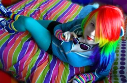 Size: 1024x666 | Tagged: safe, artist:amphyrainbows, derpibooru import, rainbow dash, human, bed, cosplay, irl, irl human, looking at you, photo, solo