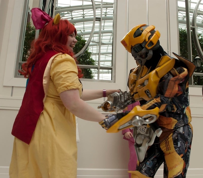 Size: 800x705 | Tagged: safe, derpibooru import, apple bloom, human, bumblebee, cosplay, dancing, irl, irl human, katsucon, photo, transformers