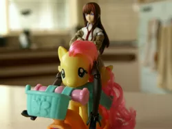 Size: 3648x2736 | Tagged: basket, boots, brushable, clothes, crossover, derpibooru import, figma, fluttershy, irl, makise kurisu, necktie, photo, pink mane, red hair, riding, safe, scarf, scooter, steins;gate, toy, toy pony cavalry