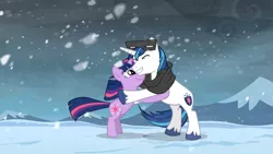 Size: 1365x768 | Tagged: clothes, derpibooru import, hug, safe, scarf, screencap, shining armor, snow, snowfall, snow goggles, the crystal empire, twilight sparkle