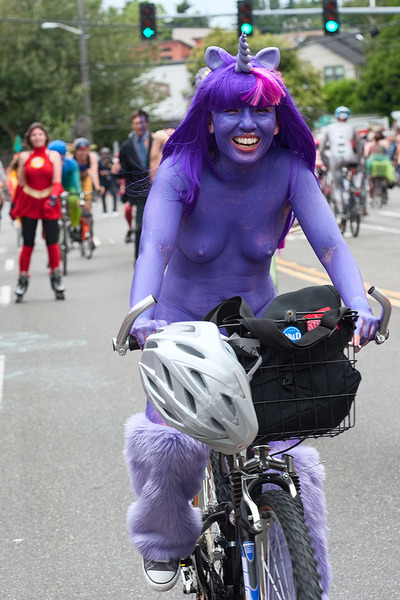 Size: 683x1024 | Tagged: belly button, bicycle, bodypaint, breasts, cosplay, derpibooru import, female, human, human exhibitionism, human nudity, irl, irl human, leg warmers, nipples, nudity, photo, photographer:willpeterman, questionable, solo, solo female, solstice cyclists, twilight sparkle