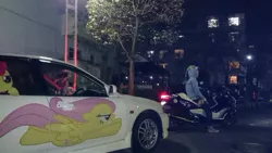 Size: 599x337 | Tagged: 2014, brony, car, clothes, convention, custom, decal, derpibooru import, fluttershy, hoodie, irl, itasha, japan, japan ponycon, motorcycle, night, photo, rainbow dash, safe