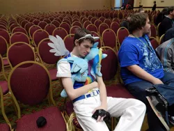 Size: 960x720 | Tagged: backpack, brony, build-a-bear, chair, convention, cosplay, derpibooru import, human, iphone, irl, irl human, photo, plushie, pony ears, rainbow dash, safe, source needed, sunglasses