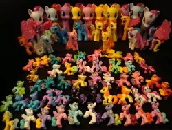 Size: 3072x2304 | Tagged: safe, derpibooru import, applejack, big macintosh, dainty daisy, fluttershy, forsythia, lily blossom, nurse coldheart, nurse snowheart, pepperdance, periwinkle, pinkie pie, ploomette, prism glider, prism strider, rainbow dash, rarity, twilight sparkle, twilight velvet, gryphon, zebra, black background, blind bag, bootleg, brushable, collection, fashion style, g4, irl, mane six, nightmare applejack, nightmare pinkie, nightmarified, photo, race swap, recolor, simple background, toy, wonderbolts