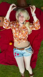 Size: 2322x4128 | Tagged: applejack, artist:kainusx, clothes, cosplay, costume, daisy dukes, derpibooru import, expo anime, front knot midriff, grass, high angle, human, irl, irl human, midriff, on back, paraguay, photo, rope, safe, shorts, solo