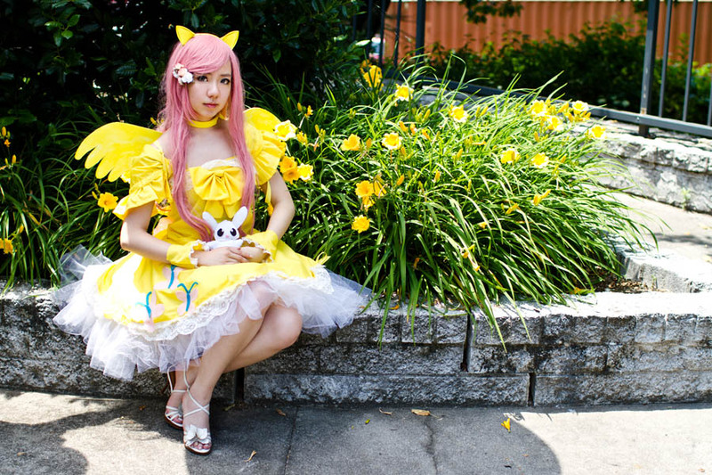 Size: 900x600 | Tagged: artist needed, safe, derpibooru import, angel bunny, fluttershy, human, 2012, animenext, choker, clothes, convention, cosplay, dress, high heels, irl, irl human, photo, sitting, solo