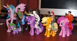 Size: 1200x648 | Tagged: applejack, derpibooru import, flint, g.i. joe, humans riding ponies, merchandise, pinkie pie, princess celestia, riding, roadblock, safe, scarlett, spike, storm shadow, toy pony cavalry, twilight sparkle