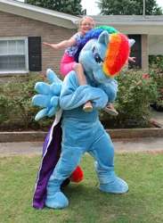 Size: 704x960 | Tagged: artist:judhudson, cosplay, derpibooru import, fursuit, human, irl, irl human, photo, rainbow dash, riding, safe, solo