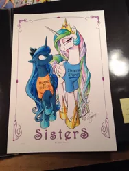 Size: 768x1024 | Tagged: safe, artist:andypriceart, derpibooru import, princess celestia, princess luna, alicorn, pony, andy price, andy you magnificent bastard, angry, bedroom eyes, blame my sister, clothes, duo, female, frown, glare, i'm with stupid, looking at you, magic shirt, mare, raised hoof, shirt, smiling, smirk, t-shirt, traditional art, trollestia, unamused