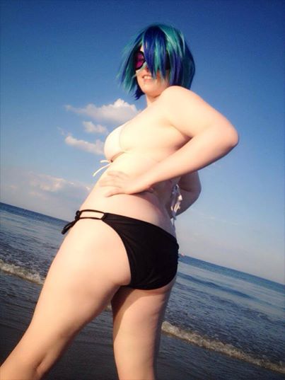 Size: 403x537 | Tagged: artist:mintyblitzz, beach, bikini, breasts, clothes, cosplay, derpibooru import, female, human, human exhibitionism, irl, irl human, photo, solo, suggestive, swimsuit, vinyl scratch