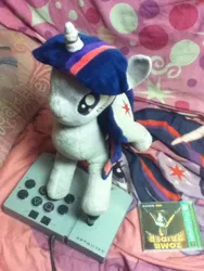 Size: 720x960 | Tagged: arcade stick, artist needed, bed, blanket, derpibooru import, horn ring, irl, jin, photo, pillow, playstation, plushie, safe, tomb raider, twilight sparkle