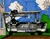 Size: 1280x1008 | Tagged: safe, artist:newyorkx3, derpibooru import, oc, oc:tommy junior, unofficial characters only, pony, cadillac, car, cloud, colt, foal, house, image, jpeg, lying down, male, outdoors, prone, shiny, smiling, solo, traditional art