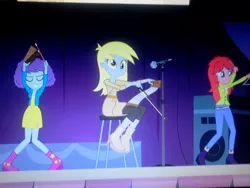 Size: 640x480 | Tagged: safe, derpibooru import, screencap, blueberry pie, derpy hooves, raspberry fluff, equestria girls, rainbow rocks, background human, cowbell, musical instrument, musical saw, saw, triangle