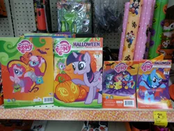 Size: 1280x960 | Tagged: safe, derpibooru import, cheerilee, pinkie pie, rainbow dash, rarity, spike, twilight sparkle, twilight sparkle (alicorn), alicorn, pony, activity book, book, costume, female, halloween, irl, mare, photo, pumpkin bucket, rearing, trick or treat, walgreens