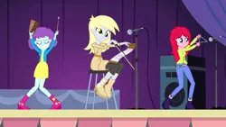 Size: 1280x720 | Tagged: safe, derpibooru import, screencap, blueberry pie, derpy hooves, raspberry fluff, equestria girls, rainbow rocks, background human, cowbell, kimber benton, musical instrument, musical saw, saw, smiling, stage, the muffins, triangle, trio